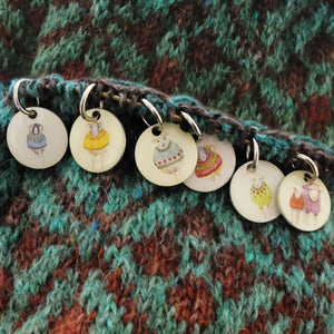 Sheep in Sweaters stitch markers in a pocket tin